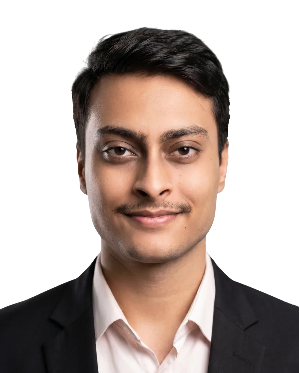 Haris Rehman, head and shoulders, in a dark jacket over an open pale shirt, looking directly at the camera.